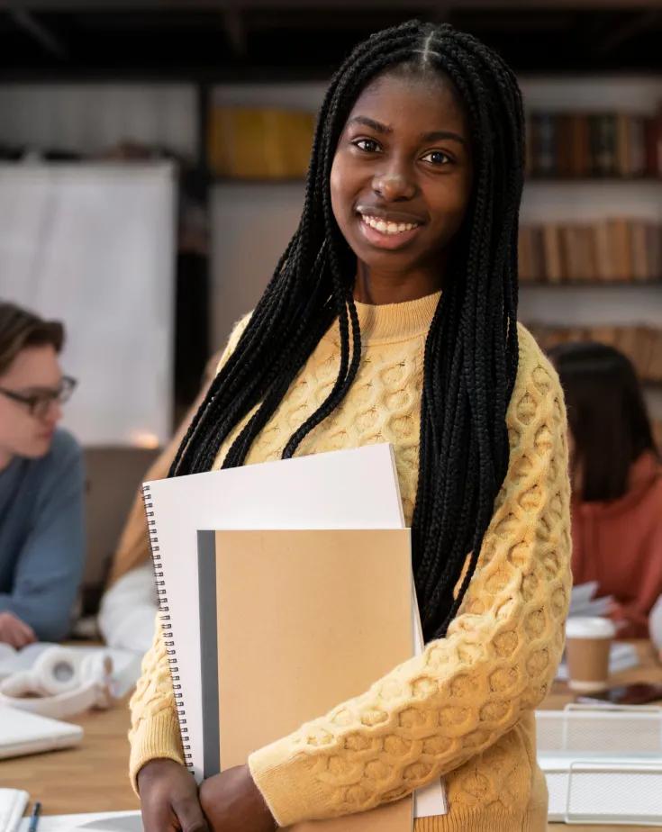 A female student posing during a group study session