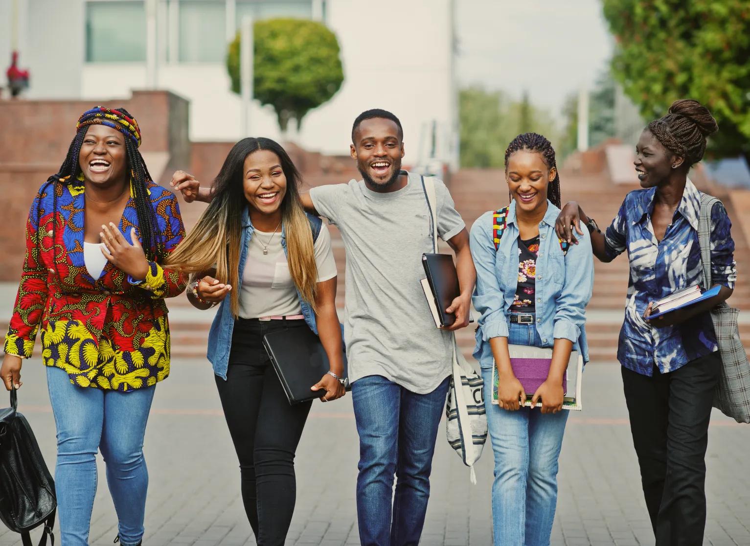 Five college students walking together